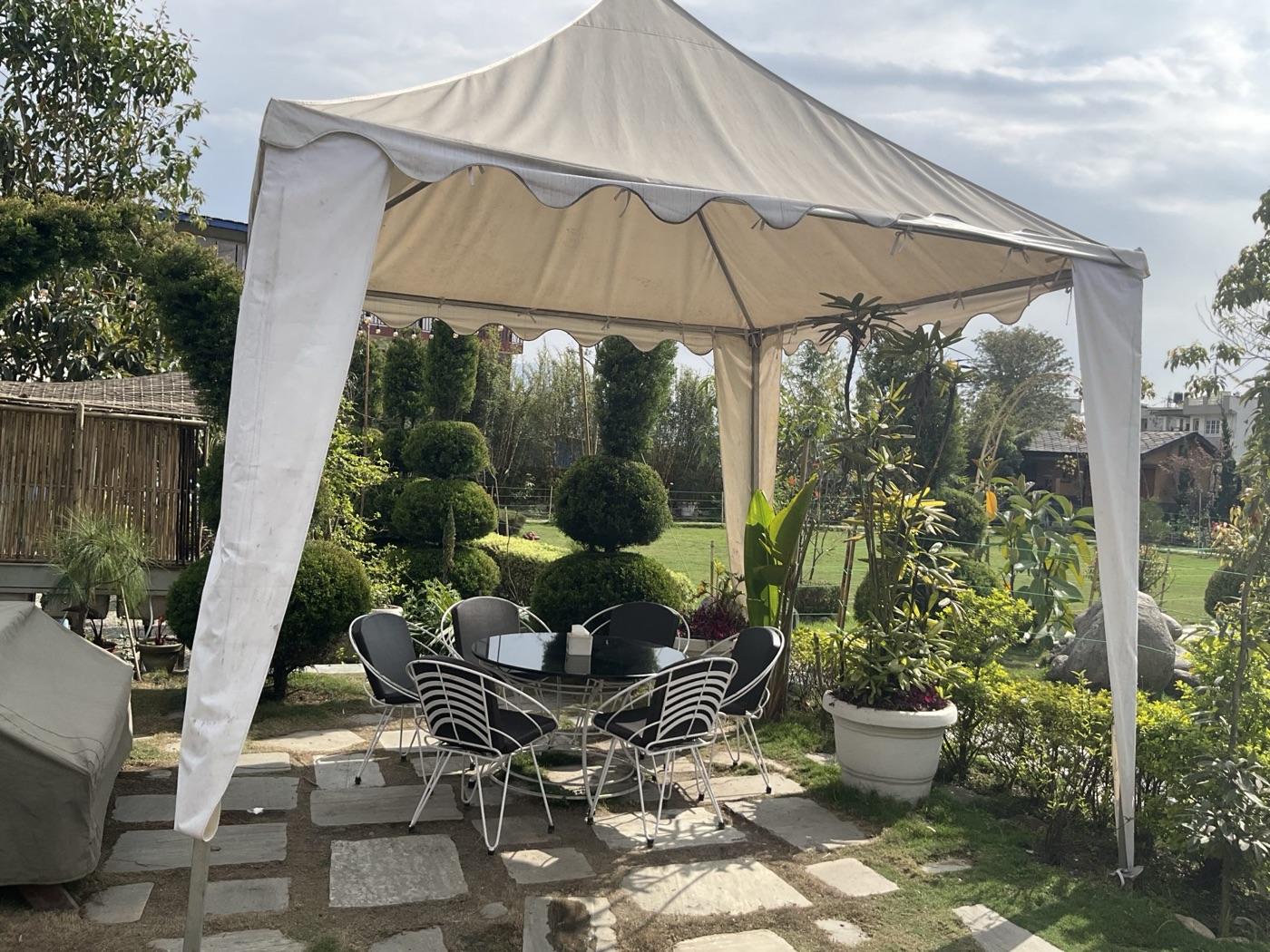 Fabric canopy shelter structure set up outdoors