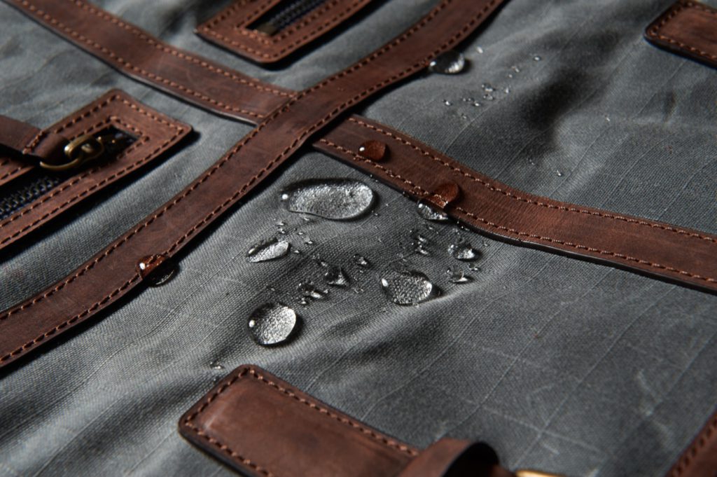 Water beading on wax-coated waterproof canvas fabric