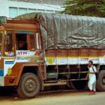 Indian goods truck with its load covered by a canvas tarpaulin